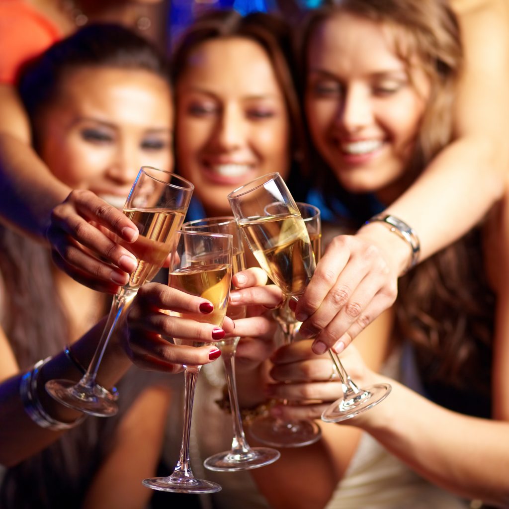 image of 3 women toasting with champagne glasses