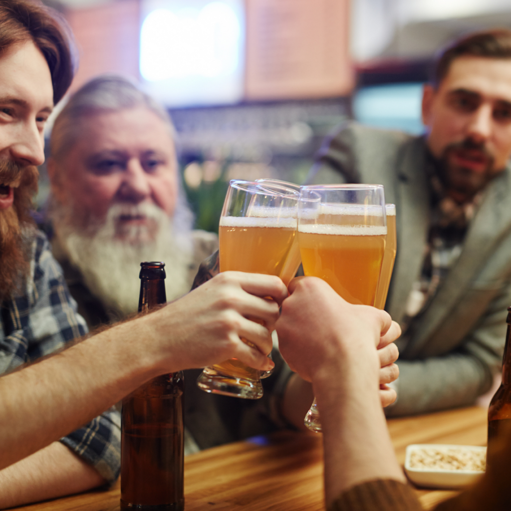 group of men toasting with beer